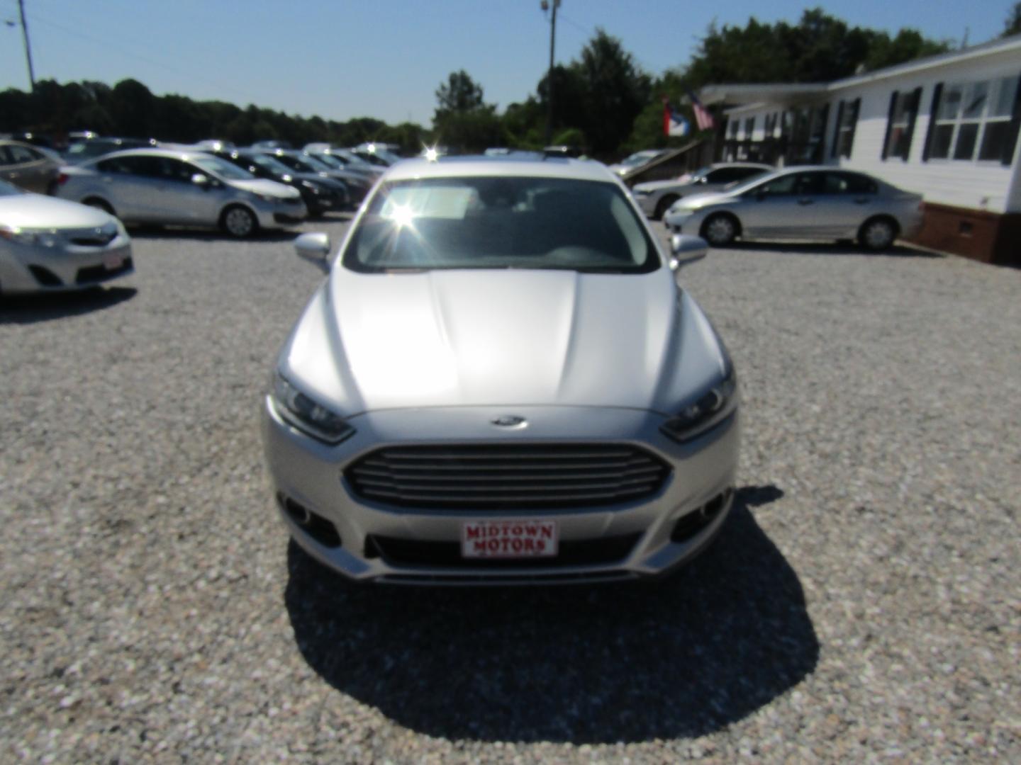 2016 Silver Ford Fusion Titanium (3FA6P0K96GR) with an 2.0L L4 DOHC 16V engine, Automatic transmission, located at 15016 S Hwy 231, Midland City, AL, 36350, (334) 983-3001, 31.306210, -85.495277 - Photo#1